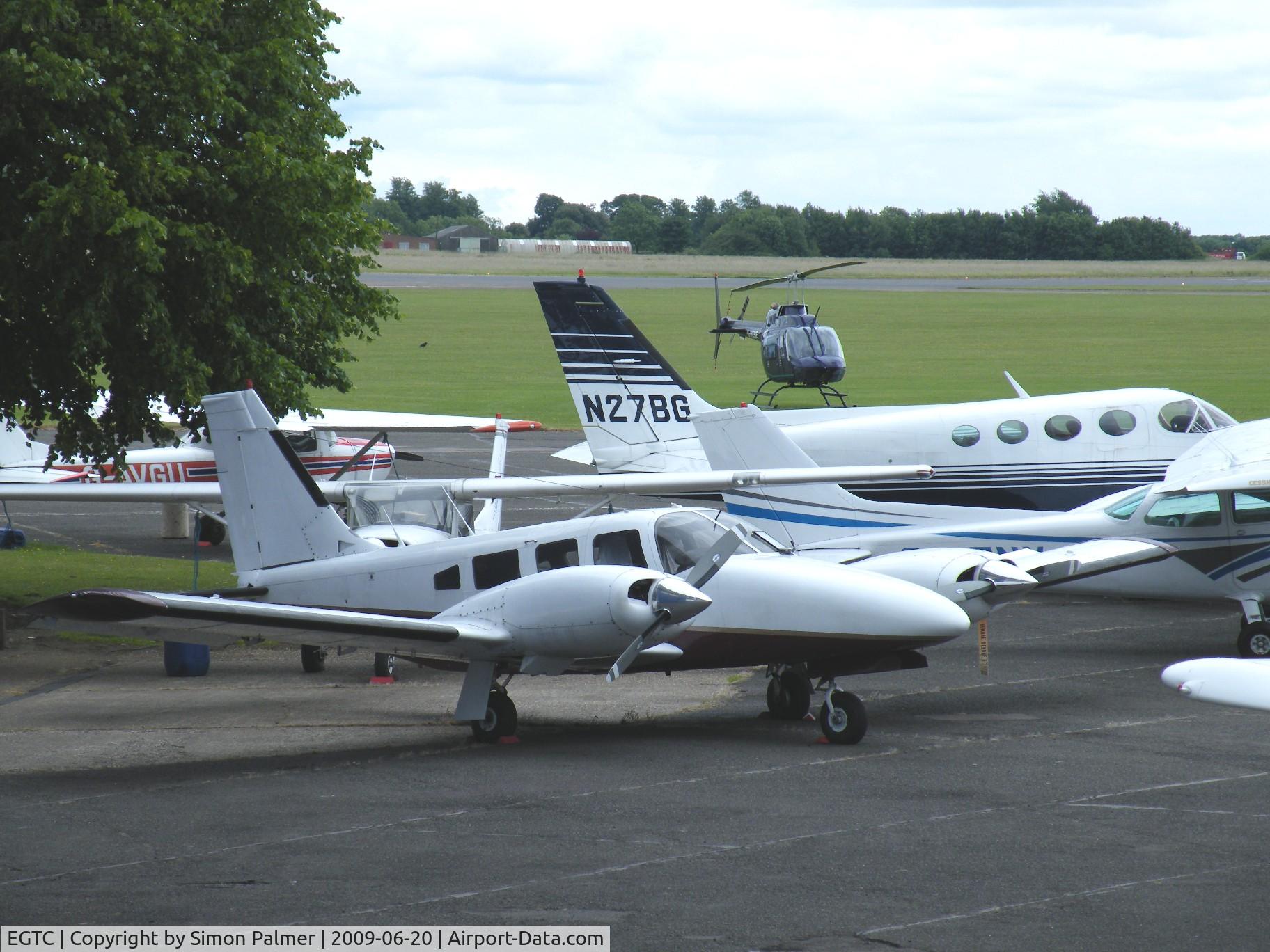 Cranfield Airport, Cranfield, England United Kingdom (EGTC) - Crowded apron at Cranfield