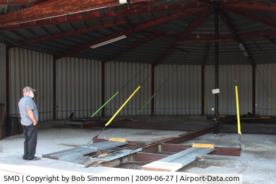 Smith Field Airport (SMD) - Sam studying the unique roundhouse style hangar.