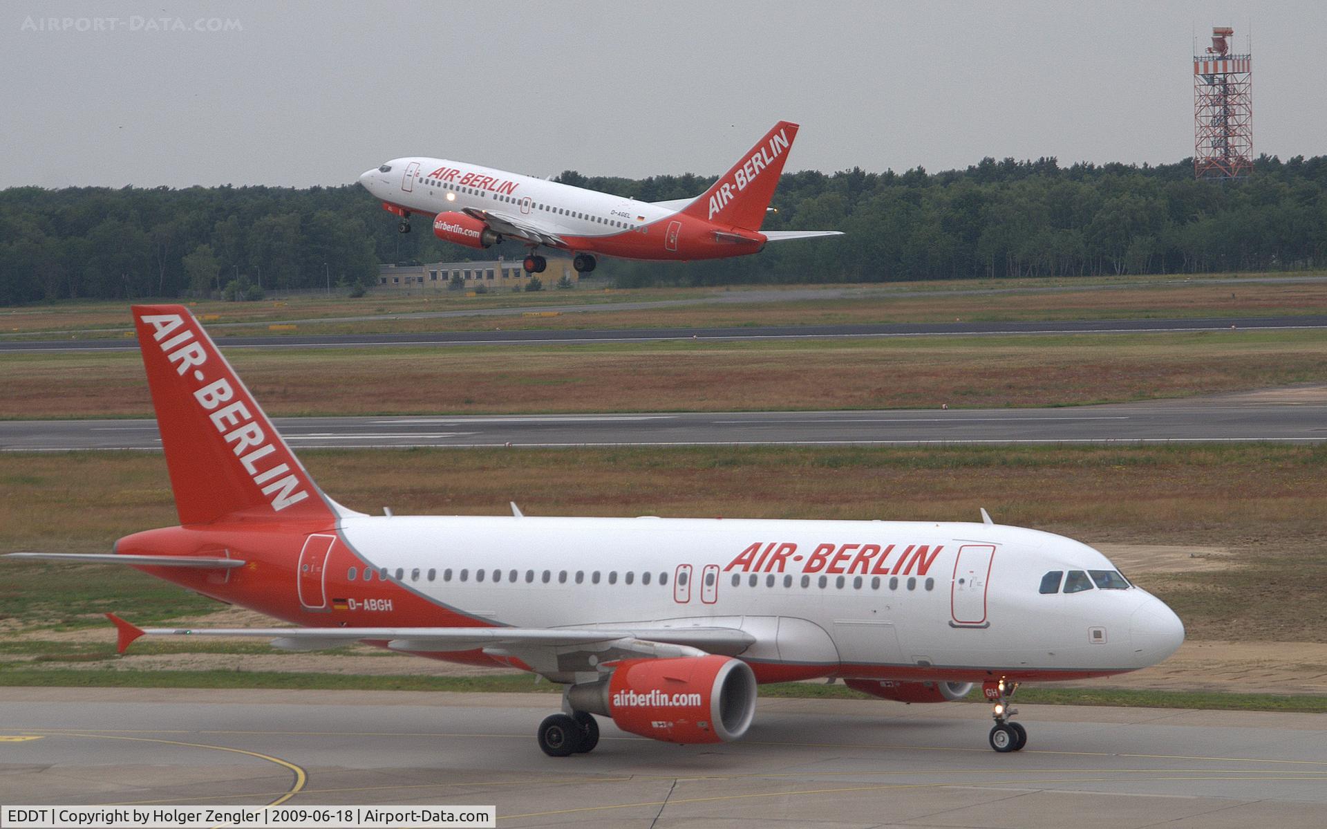 Tegel International Airport (closing in 2011), Berlin Germany (EDDT) - Just landed AIR BERLIN D-ABGH is going get passed by her sister D-AGEL which has a lift off on runway 26 R