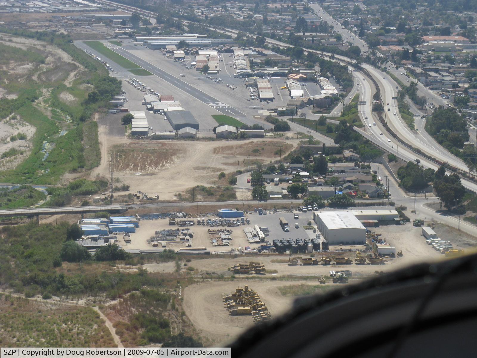 Santa Paula Airport (SZP) - Turning final for Rwy 22 in N406L. SZP is unlighted-at night aircraft have aligned with adjacent lighted freeway 126 intending to land at SZP-fortunately climbing out when error noted!