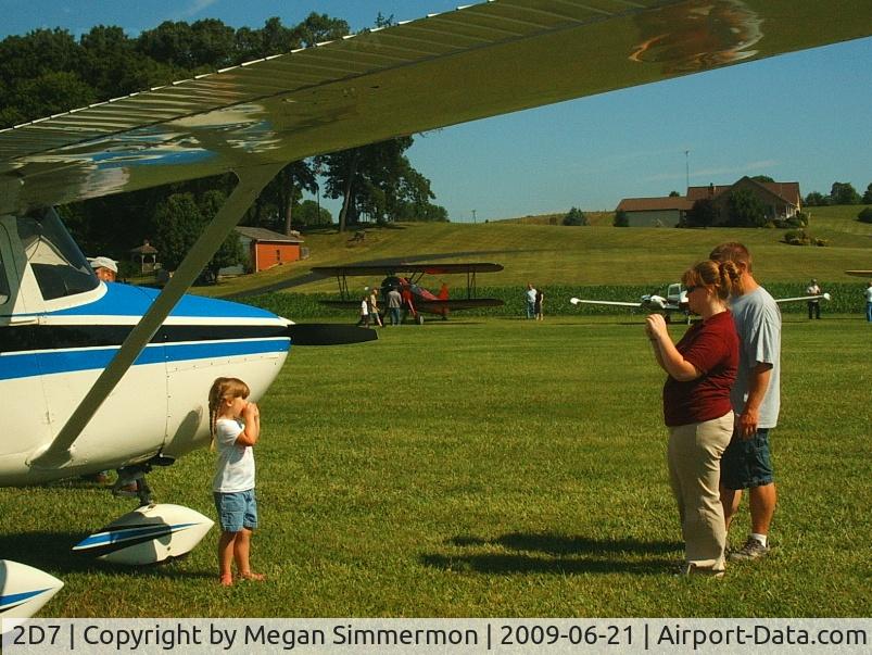 Beach City Airport (2D7) - Getting a pose in front of a vintage Cessna at the Father's Day fly-in.