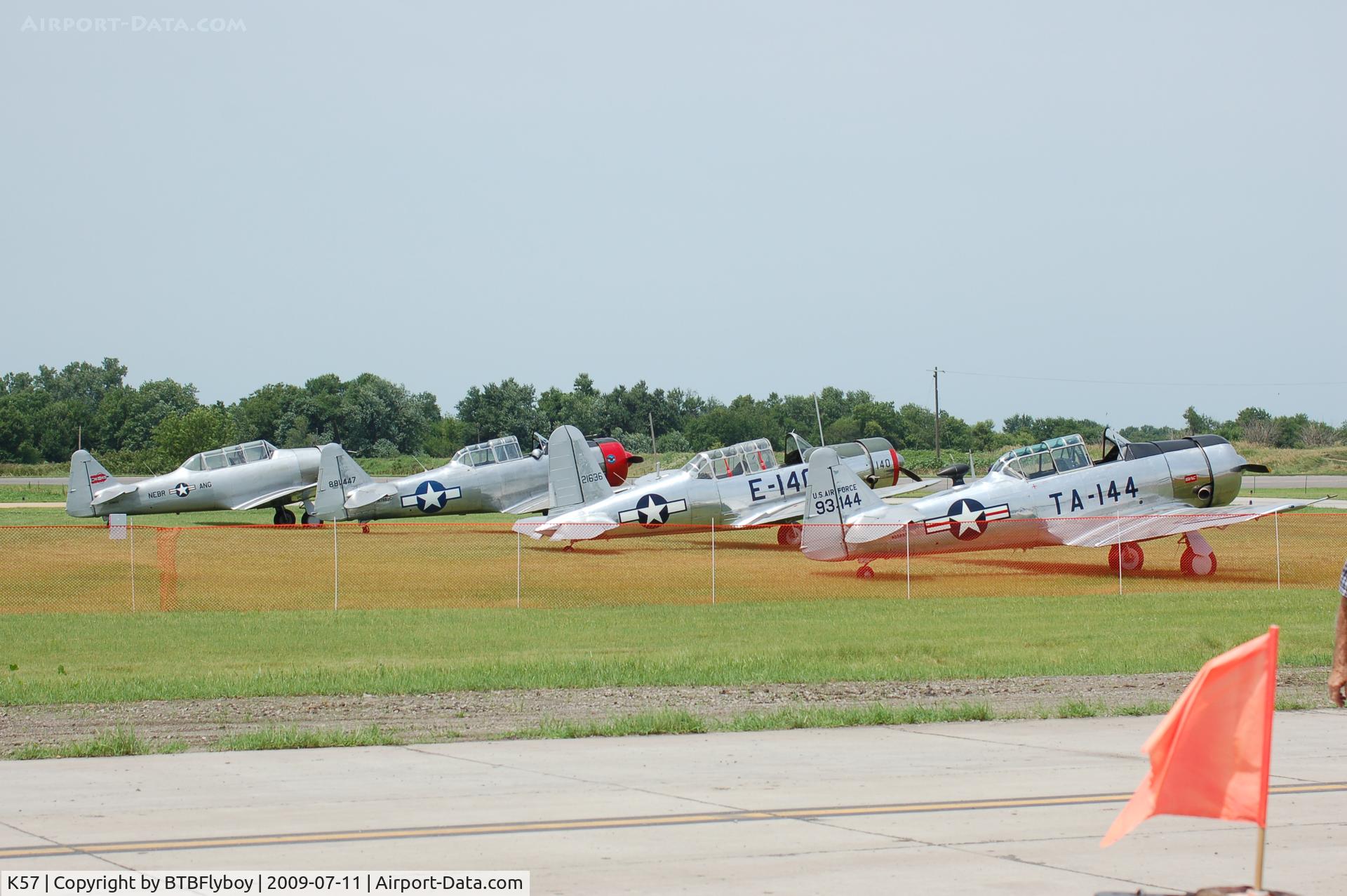 Gould Peterson Municipal Airport (K57) - Three AT-6's and a BT-13 at the annual 