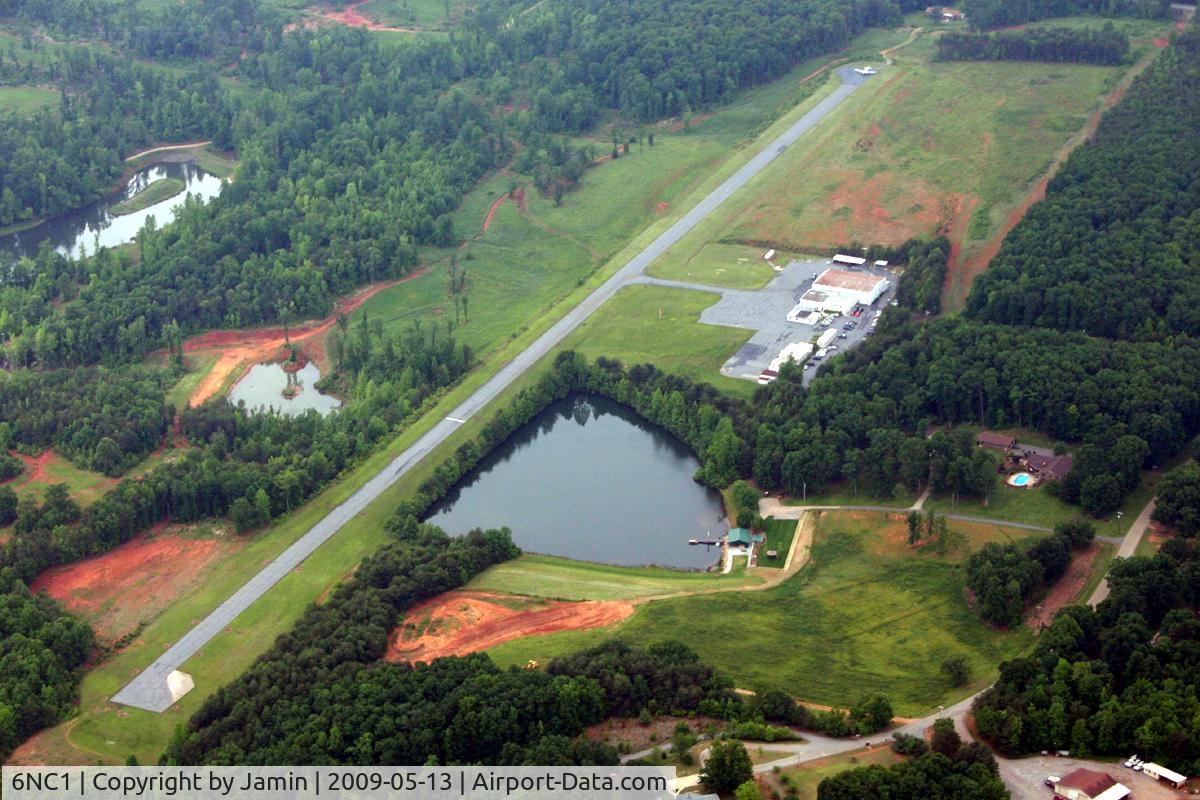 Little Mountain Airport (6NC1) - Little Mountain airport, with a King Air sitting at the end of the runway.