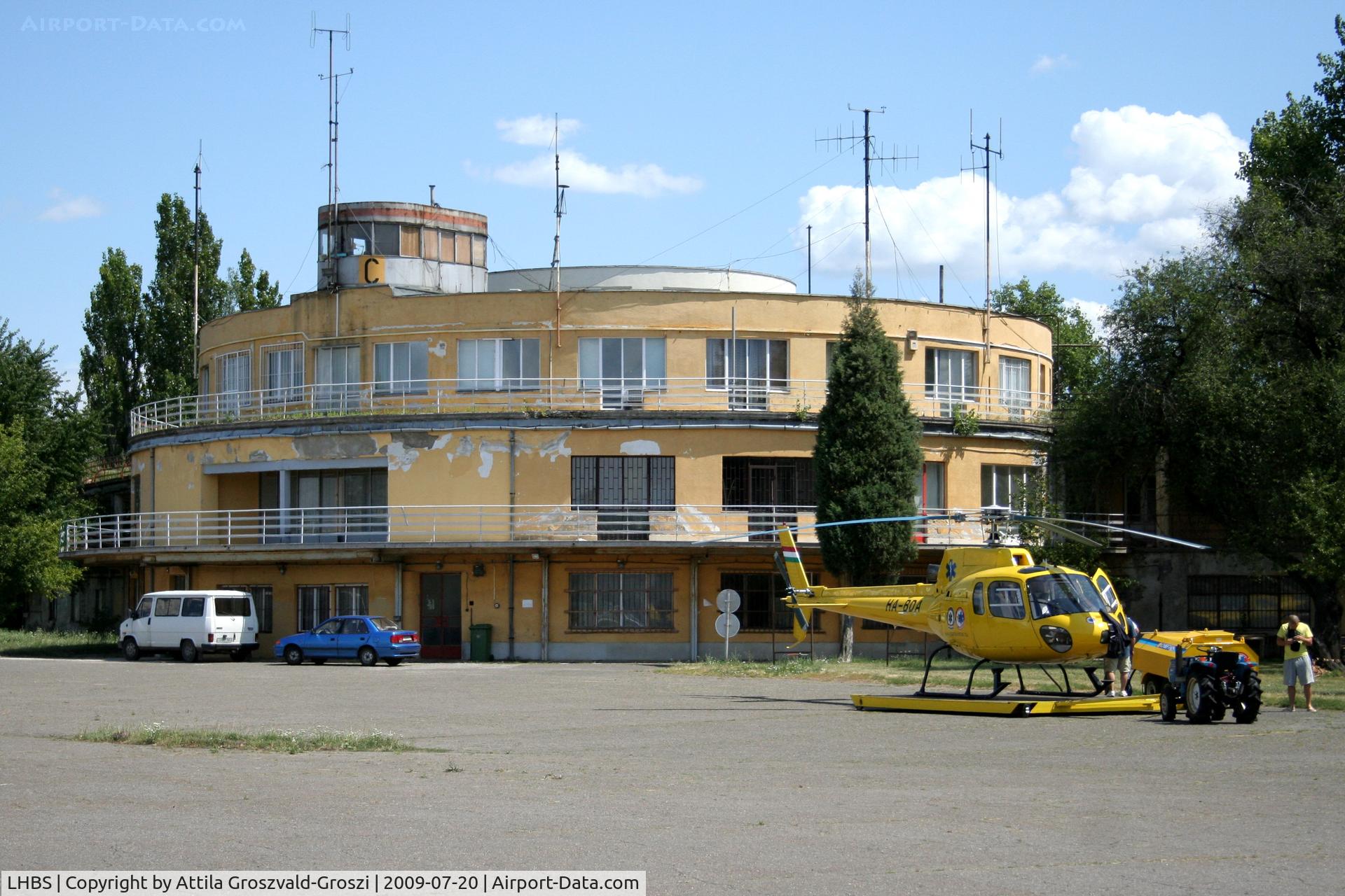 Budaörs Airport, Budaörs Hungary (LHBS) - Budaörs-Airport / Hungary - LHBS -  The main building in a forefront the national rescue service HA-BDA register Aerospatiale AS-350B Ecureuil the helicopter of an ambulance. 