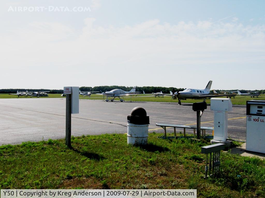 Wautoma Municipal Airport (Y50) - The ramp in Wautoma, WI. Most of these planes are parked here for EAA AirVenture, then drive over to OSH. This is a very nice airport, the picnic/spotting area in the foreground really stood out to me, looks like a great place to sit and watch planes. Too