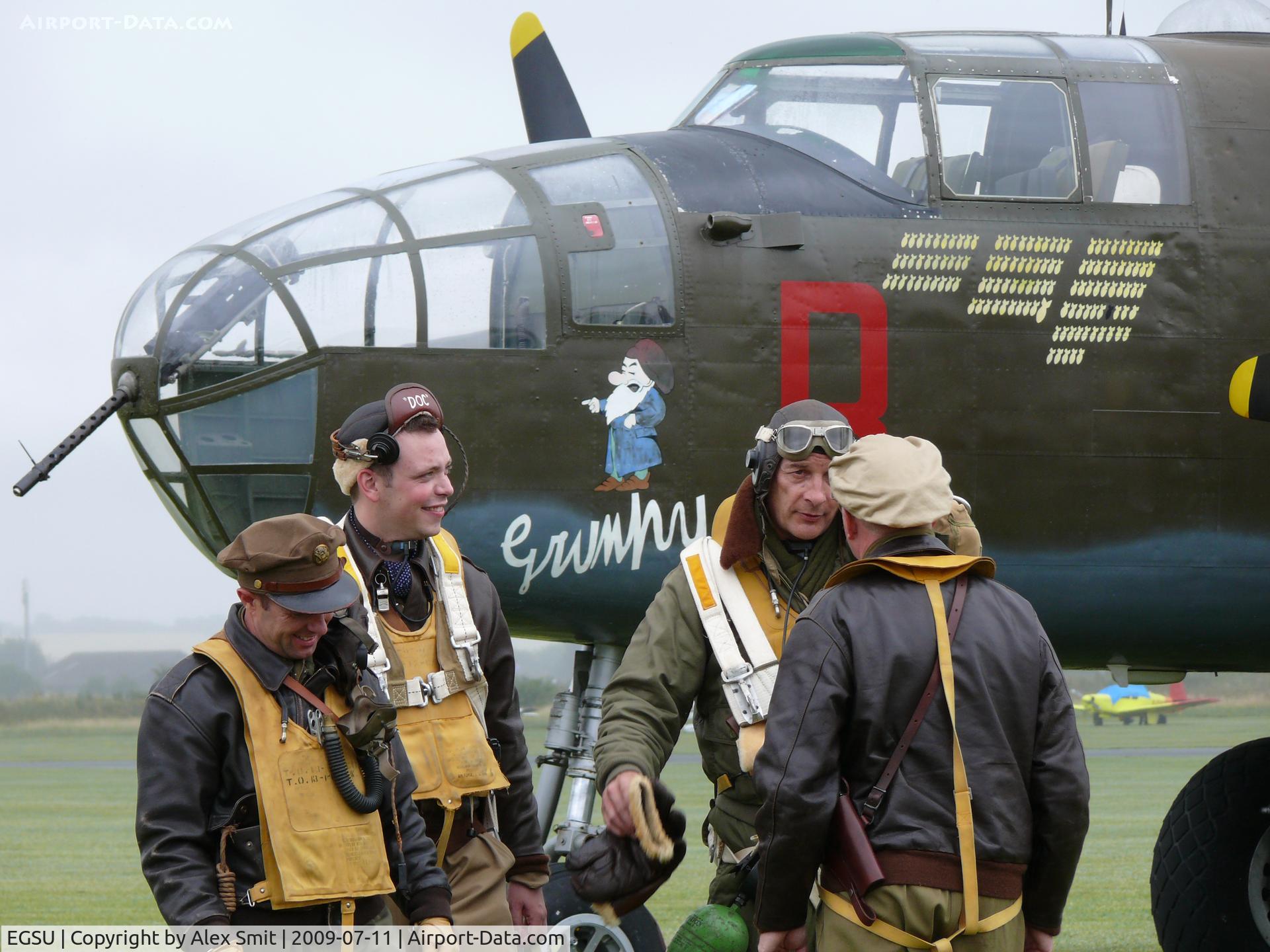 Duxford Airport, Cambridge, England United Kingdom (EGSU) - Mitchell bomber crew chatting after a rough mission