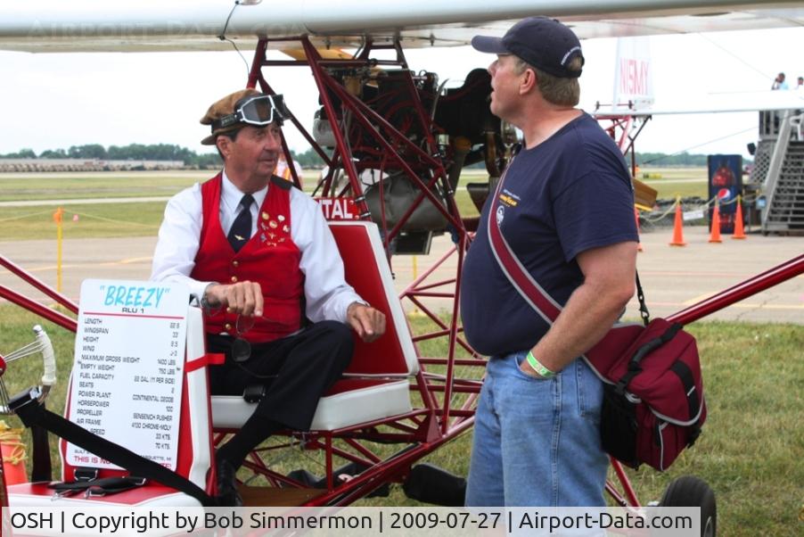 Wittman Regional Airport (OSH) - Breezy inventor Carl Unger giving building tips to Bob Simmermon.