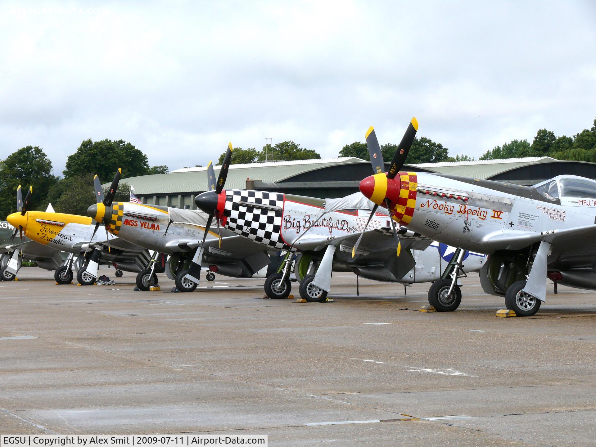 Duxford Airport, Cambridge, England United Kingdom (EGSU) - Nice line-up waiting for the action at the Flying Legends 2009