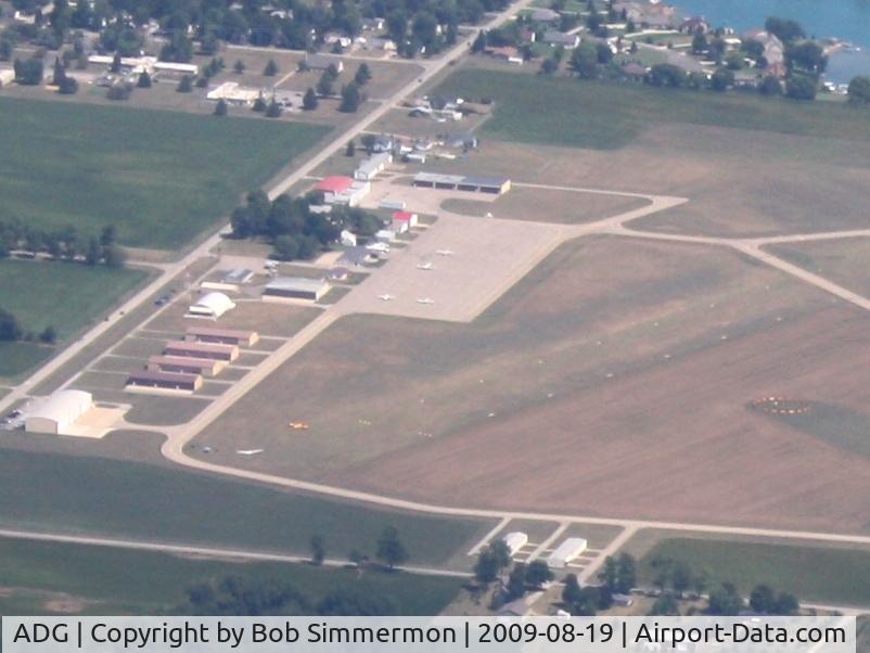 Lenawee County Airport (ADG) - Glider in tow on the grass.