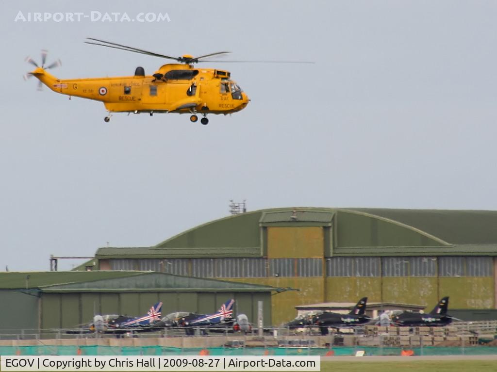 Anglesey Airport (Maes Awyr Môn) or RAF Valley, Anglesey United Kingdom (EGOV) - Sea King HAR.3 XZ591 and seven Hawks