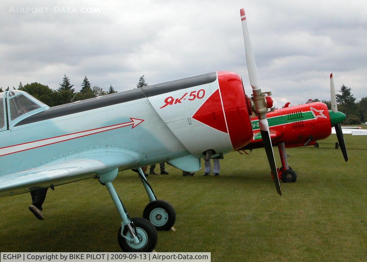 Popham Airfield Airport, Popham, England United Kingdom (EGHP) - YAK-50 G-IIYK AND SU-29 HA-YAO. POPHAM RUSSIAN AIRCRAFT FLY-IN
