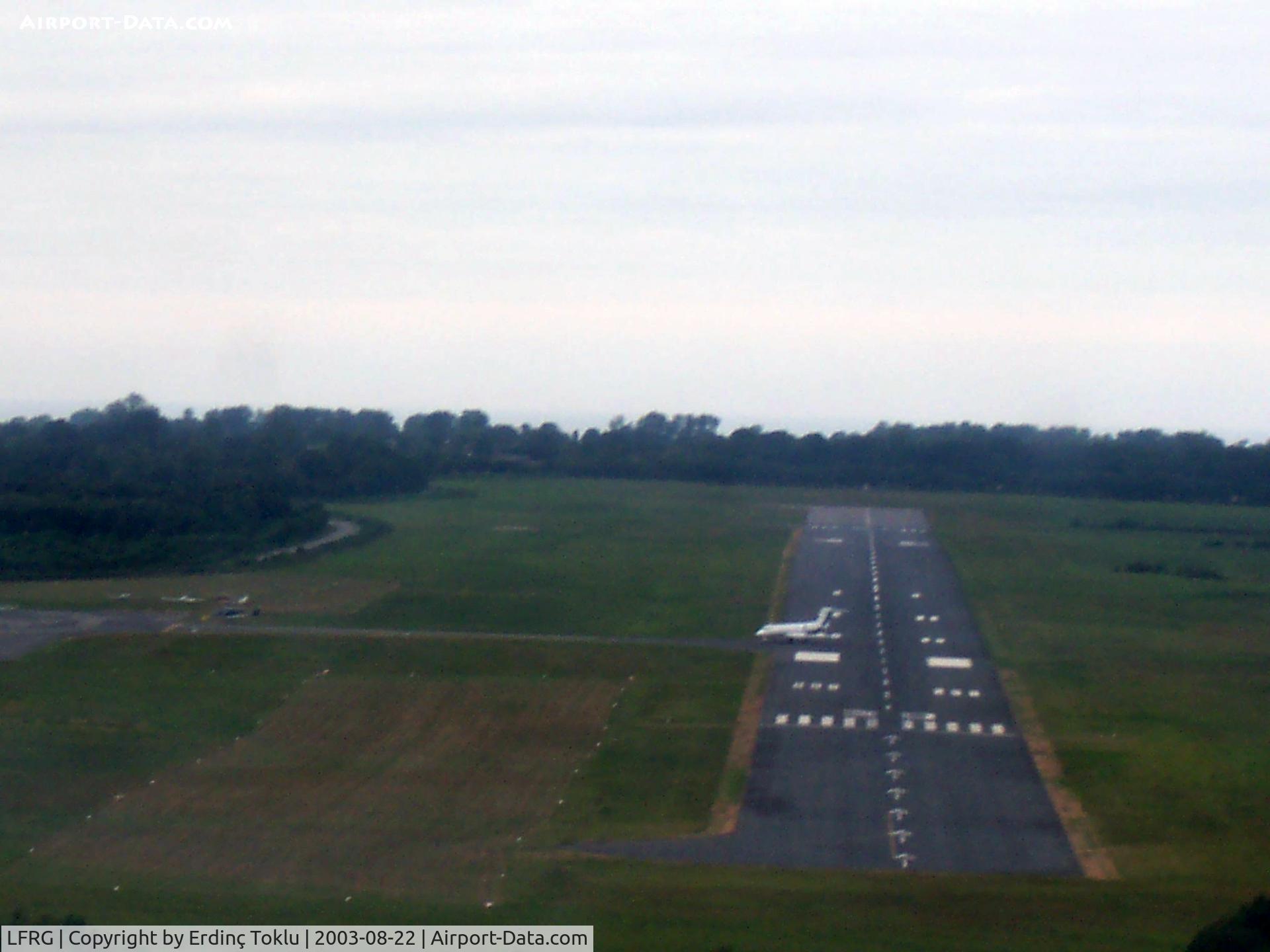 Deauville Saint-Gatien Airport, Deauville France (LFRG) - Short final Rwy 30 with a jet still on it.