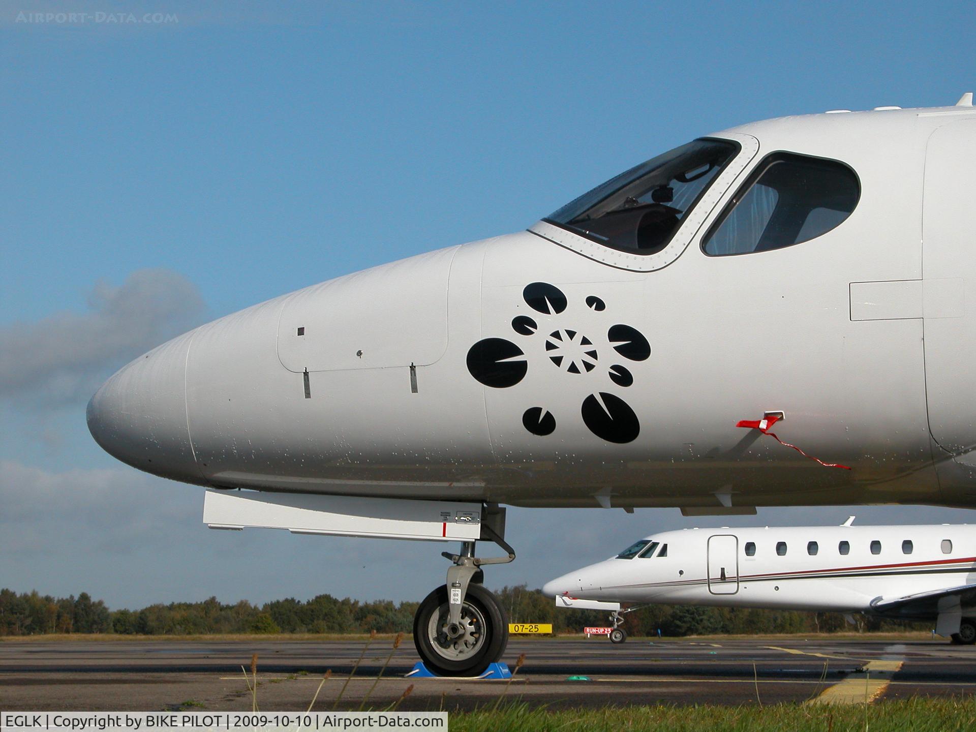 Blackbushe Airport, Camberley, England United Kingdom (EGLK) - N278SV FRAMED BY G-FBNK ON THE TERMINAL RAMP