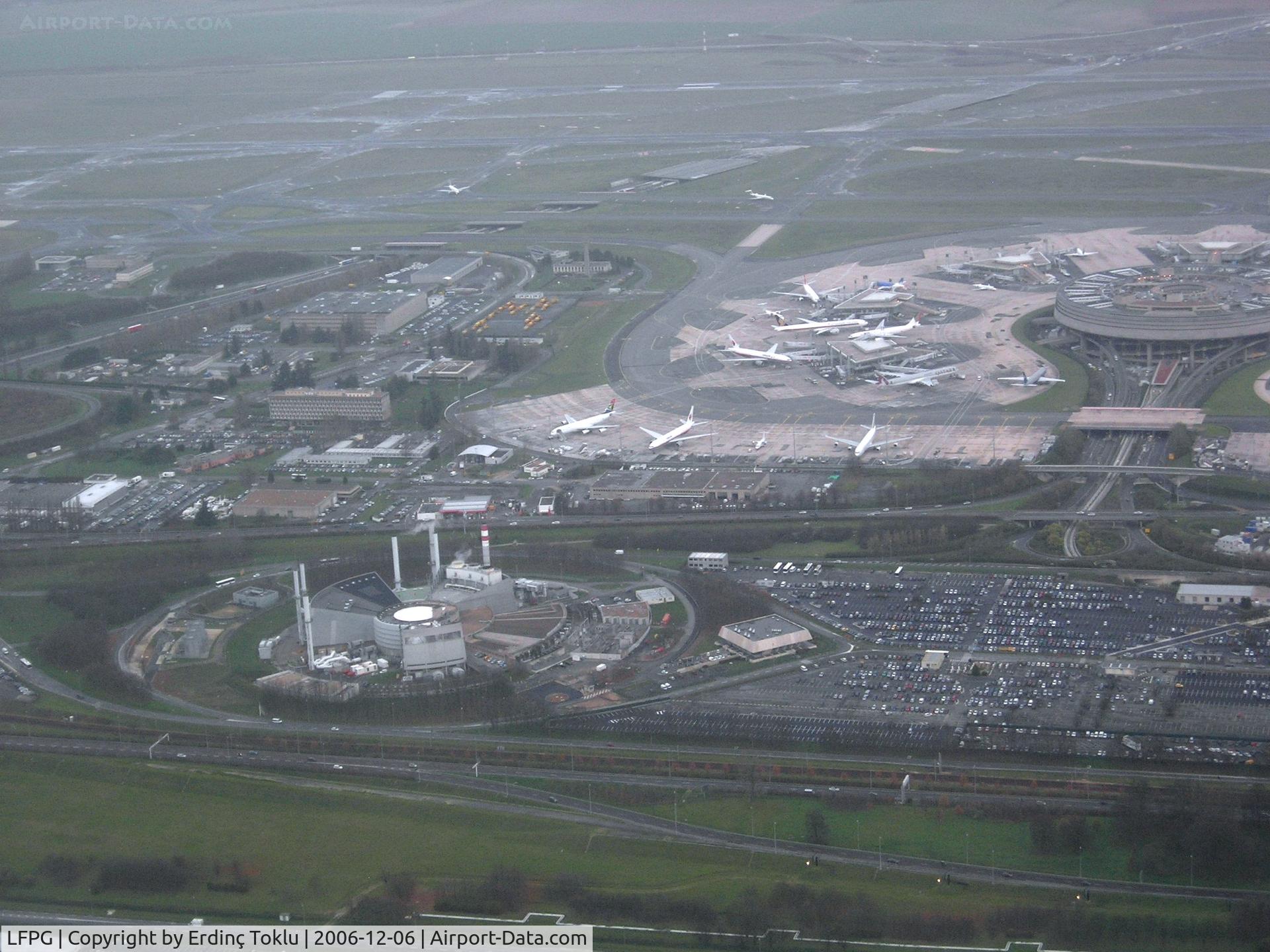 Paris Charles de Gaulle Airport (Roissy Airport), Paris France (LFPG) - Roissy CDG. Power plant and Terminal 1 (satellites 7,6,5 from right).