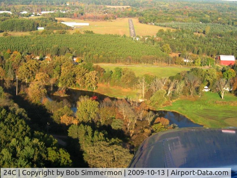 Lowell City Airport (24C) - Final for the hard surface (30). Tall obstacles on each end.