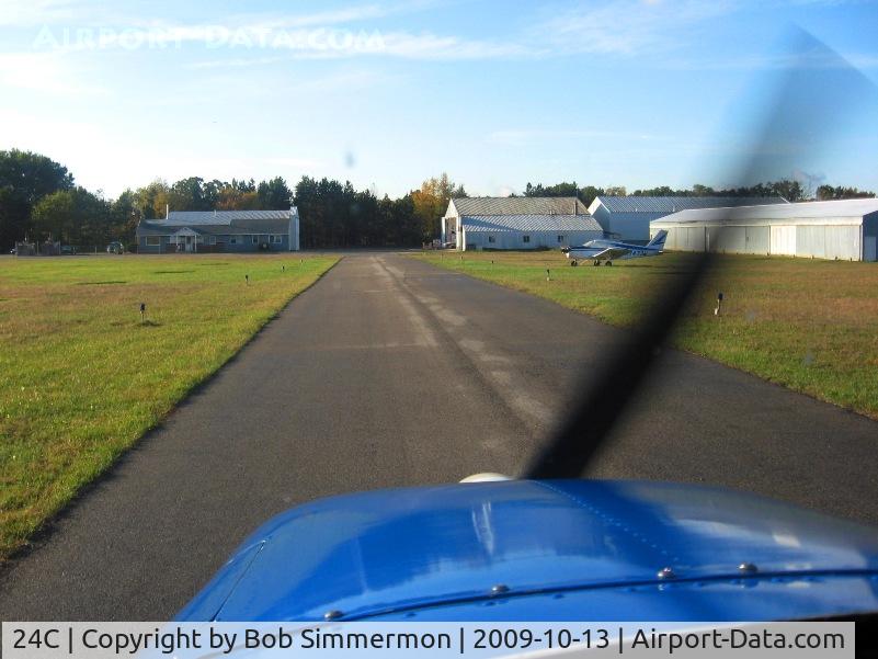 Lowell City Airport (24C) - Looking south on the taxiway.