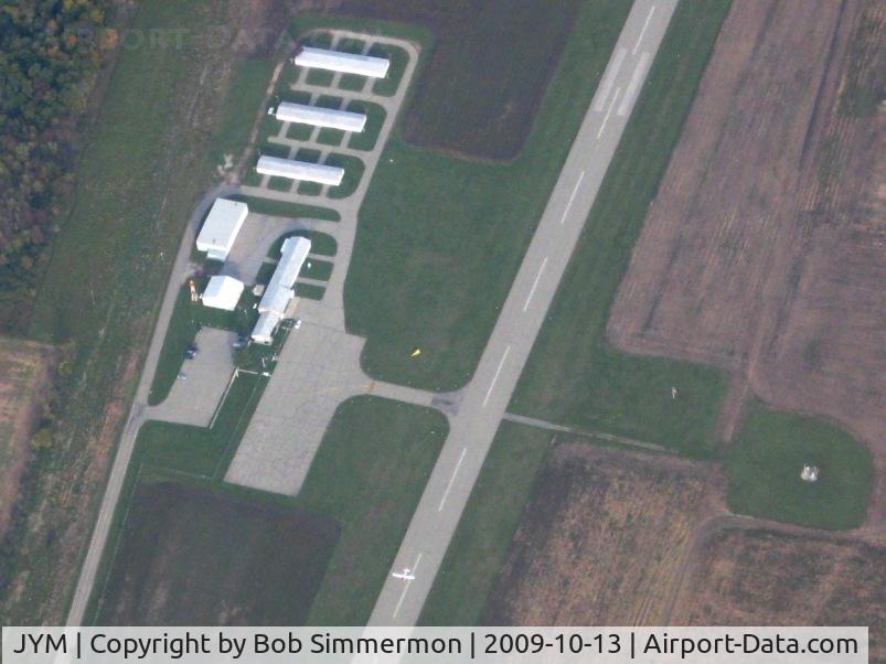 Hillsdale Municipal Airport (JYM) - View of the facilities and and aircraft departing to the west.