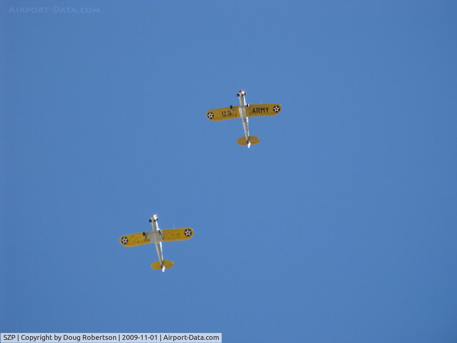 Santa Paula Airport (SZP) - Two Ryan ST-3KRs as PT-22s, N58651 #38 and N53271 #596 (in lead) overhead formation with wonderful 5 cylinder Kinner radial rumbles.