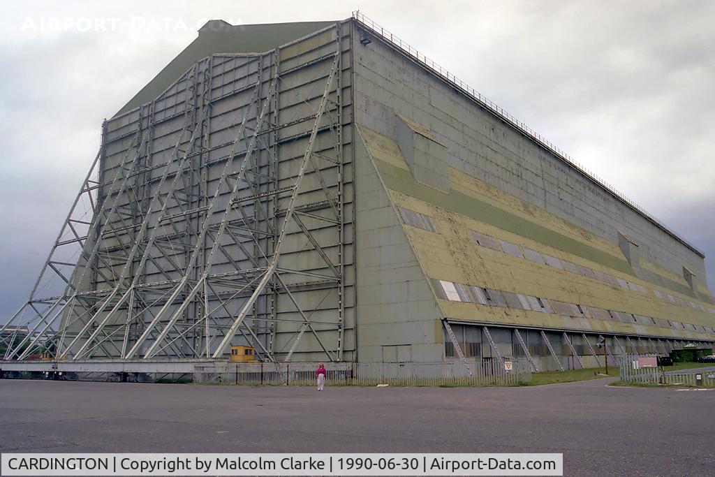 CARDINGTON Airport - One of two airship sheds at former RAF Cardington, built 1916 for the UK’s airship project. Each is 812 ft long, 180 ft wide and 157 ft high and contains 4000 tons of steel. R101 left from here on her ill fated voyage to India. The lovely Ann gives scale.