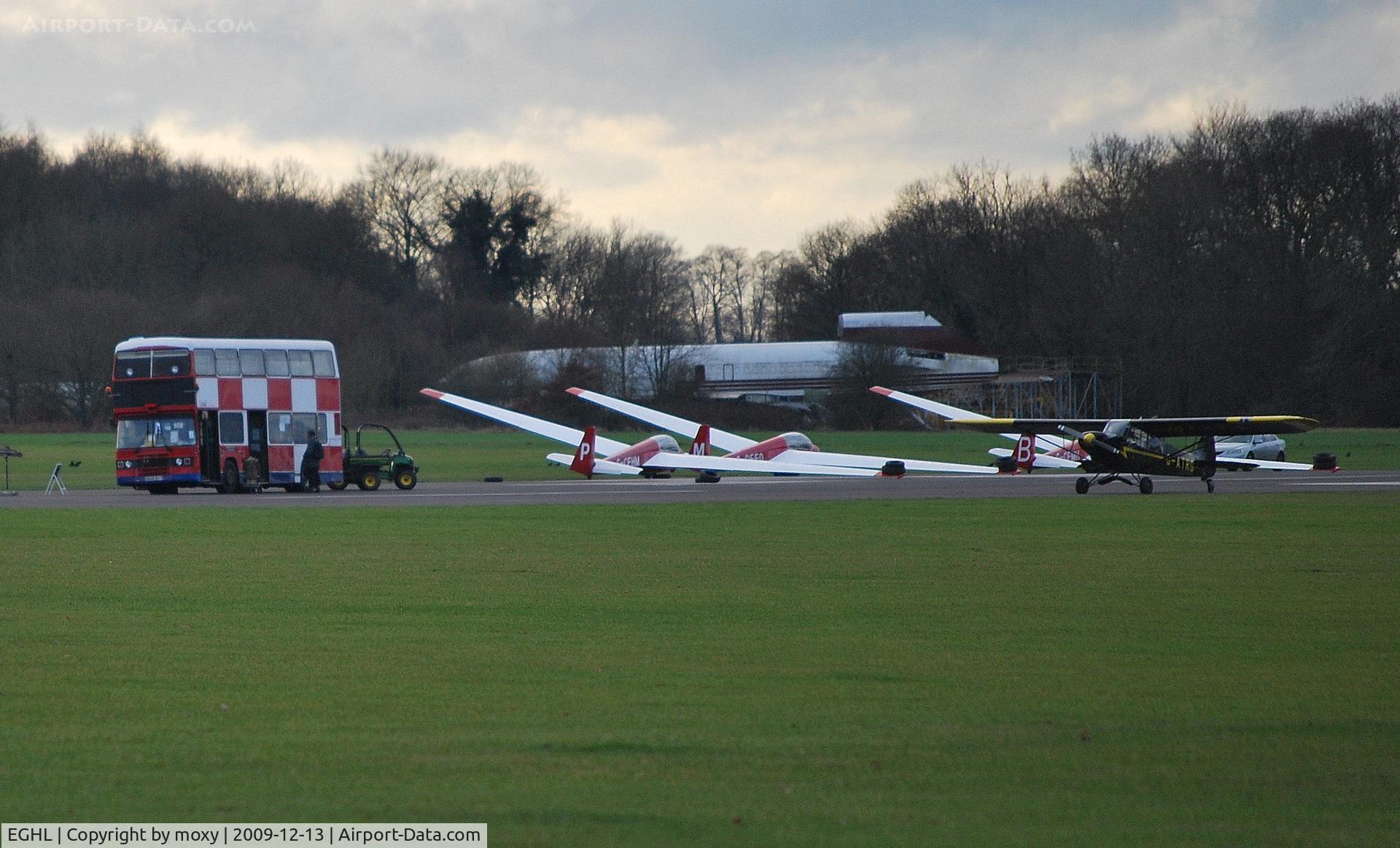 Lasham Airfield Airport, Basingstoke, England United Kingdom (EGHL) - Gliding at Lasham. Double Decker bus used as signals caravan.