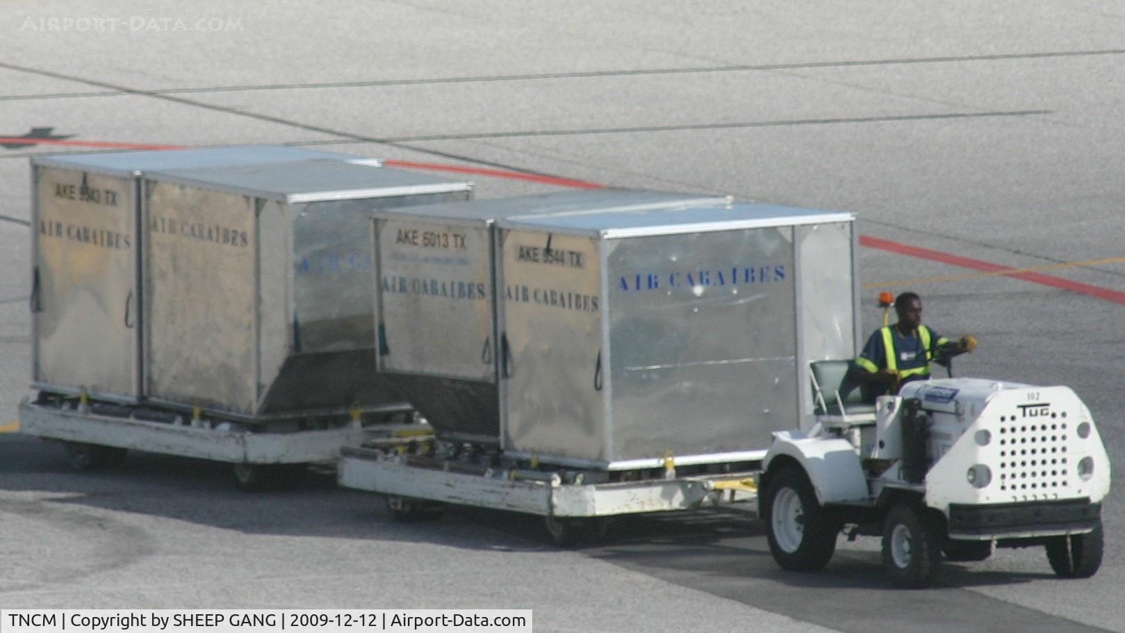 Princess Juliana International Airport, Philipsburg, Sint Maarten Netherlands Antilles (TNCM) - ground crew taking the boxes to there holding grounds