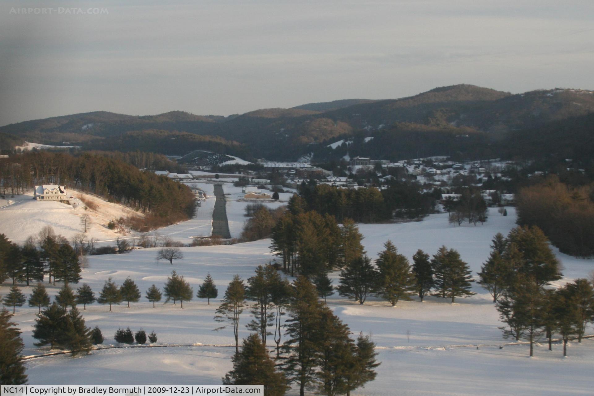 Boone Inc Airport (NC14) - On final approach in a SR-20 shortly after the field was plowed.