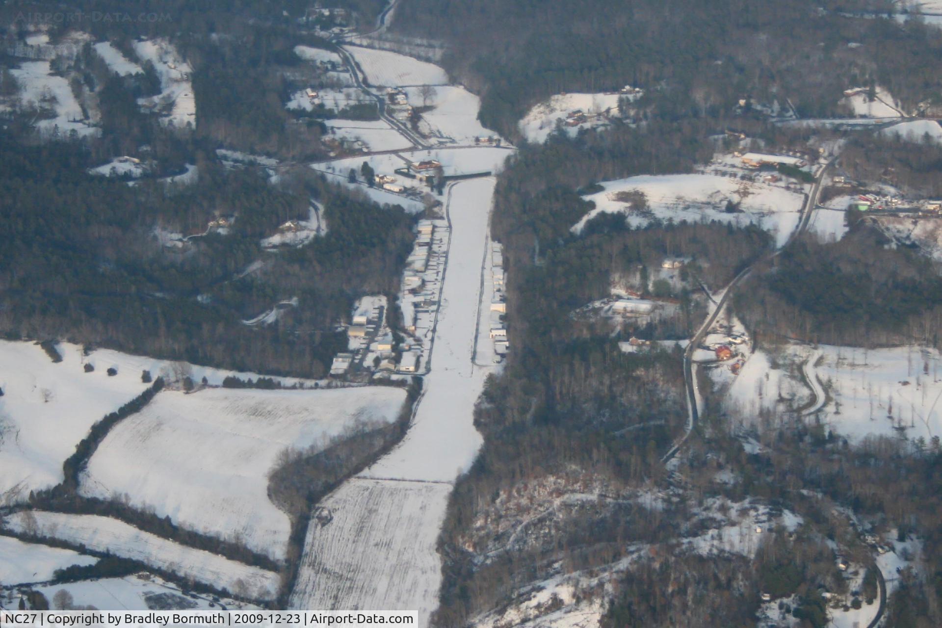 Lower Creek Airport (NC27) - Lower Creek Airport, view from the southwest.  Photo plane is a SR-20 at about 3000' AGL.