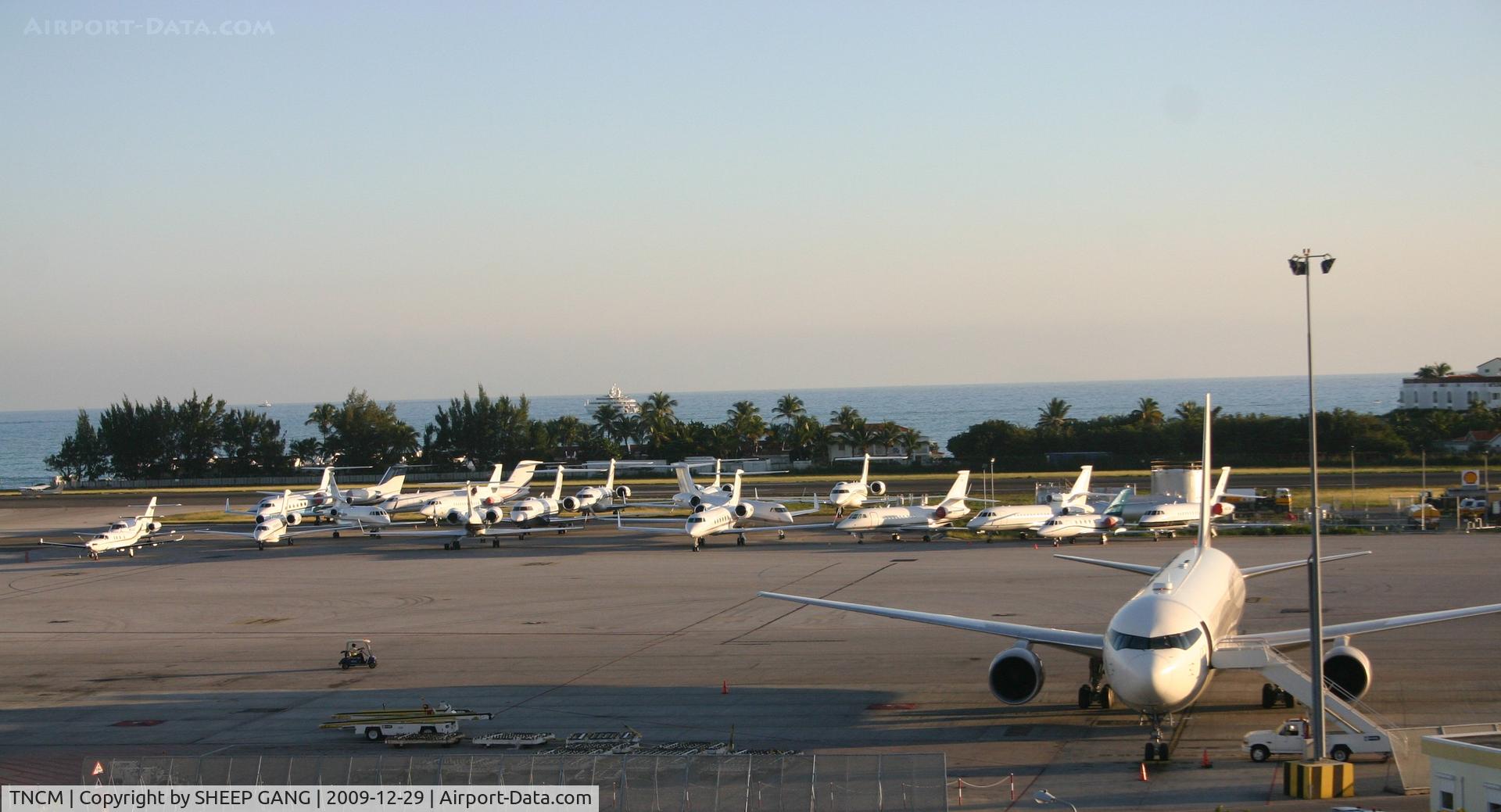 Princess Juliana International Airport, Philipsburg, Sint Maarten Netherlands Antilles (TNCM) - A look at the bravo ramp in the late afternoon with the big badit leading the way.....