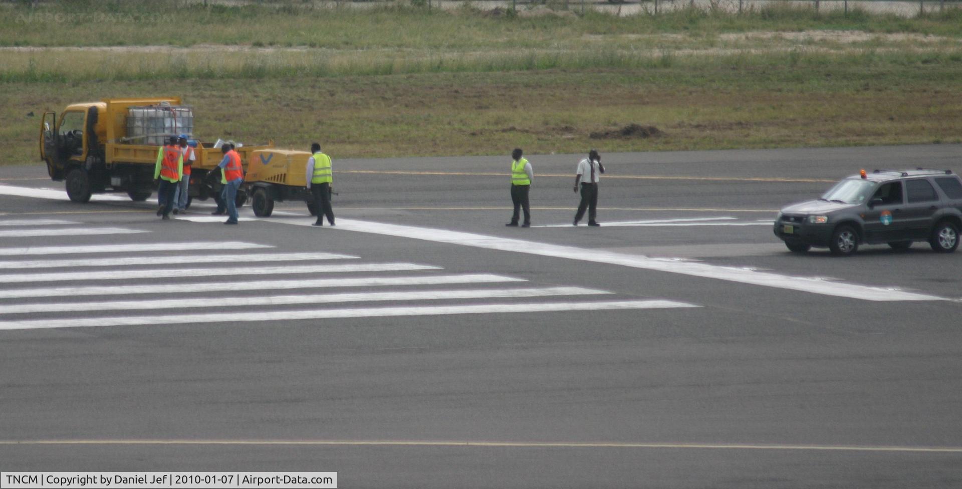 Princess Juliana International Airport, Philipsburg, Sint Maarten Netherlands Antilles (TNCM) - Repairs being done on the tresh hold of runway 10
