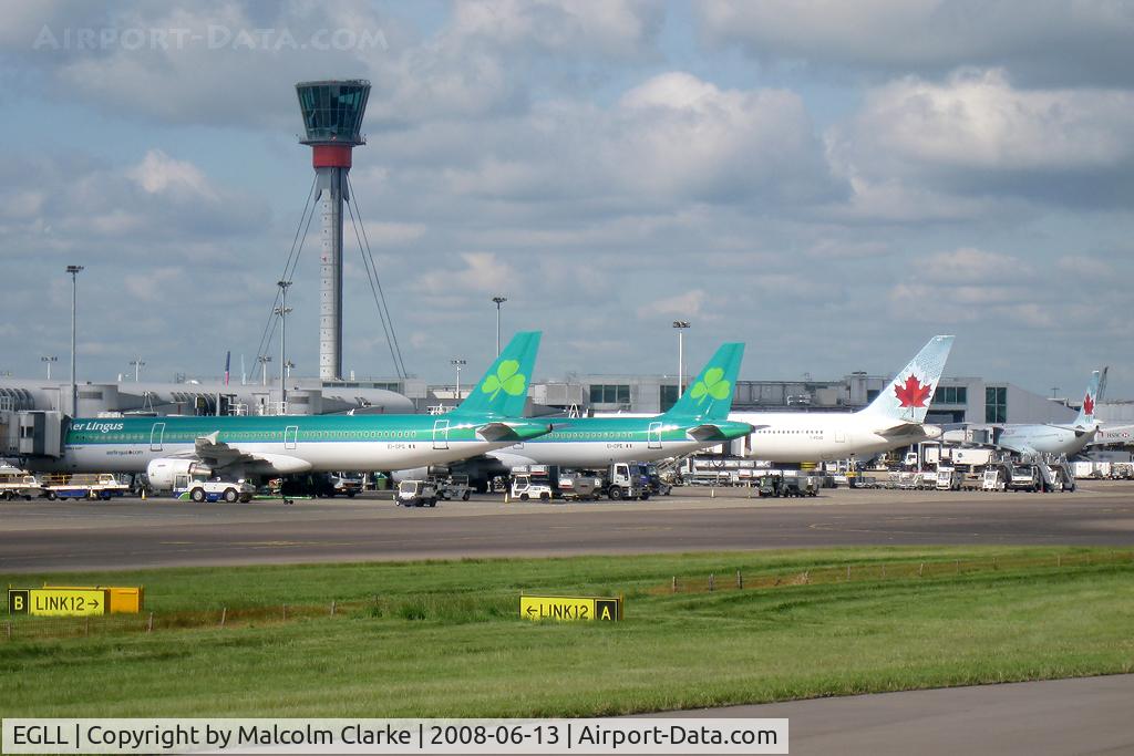 London Heathrow Airport, London, England United Kingdom (EGLL) - Taxiing to Terminal 1 past the new control tower at London-Heathrow.