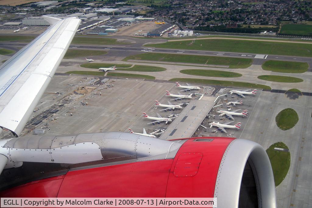 London Heathrow Airport, London, England United Kingdom (EGLL) - Some of British Airway's 747's at Terminal 5 London Heathrow seen from Airbus G-DBCG in 2008.