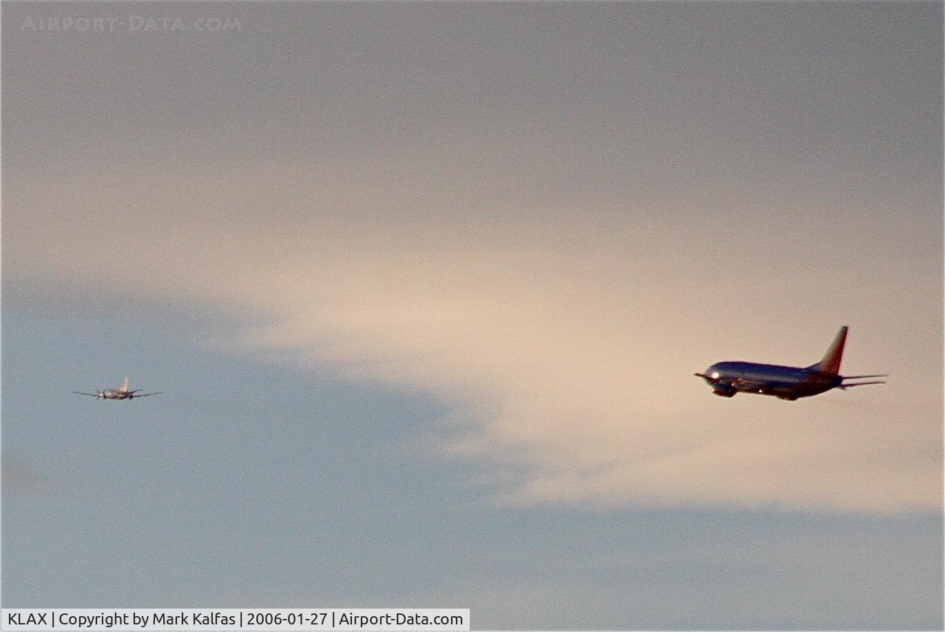 Los Angeles International Airport (LAX) - Southwest Airlines Boeing 737-7H4 following an American Eagle SAAB 340B, 24L departure KLAX.