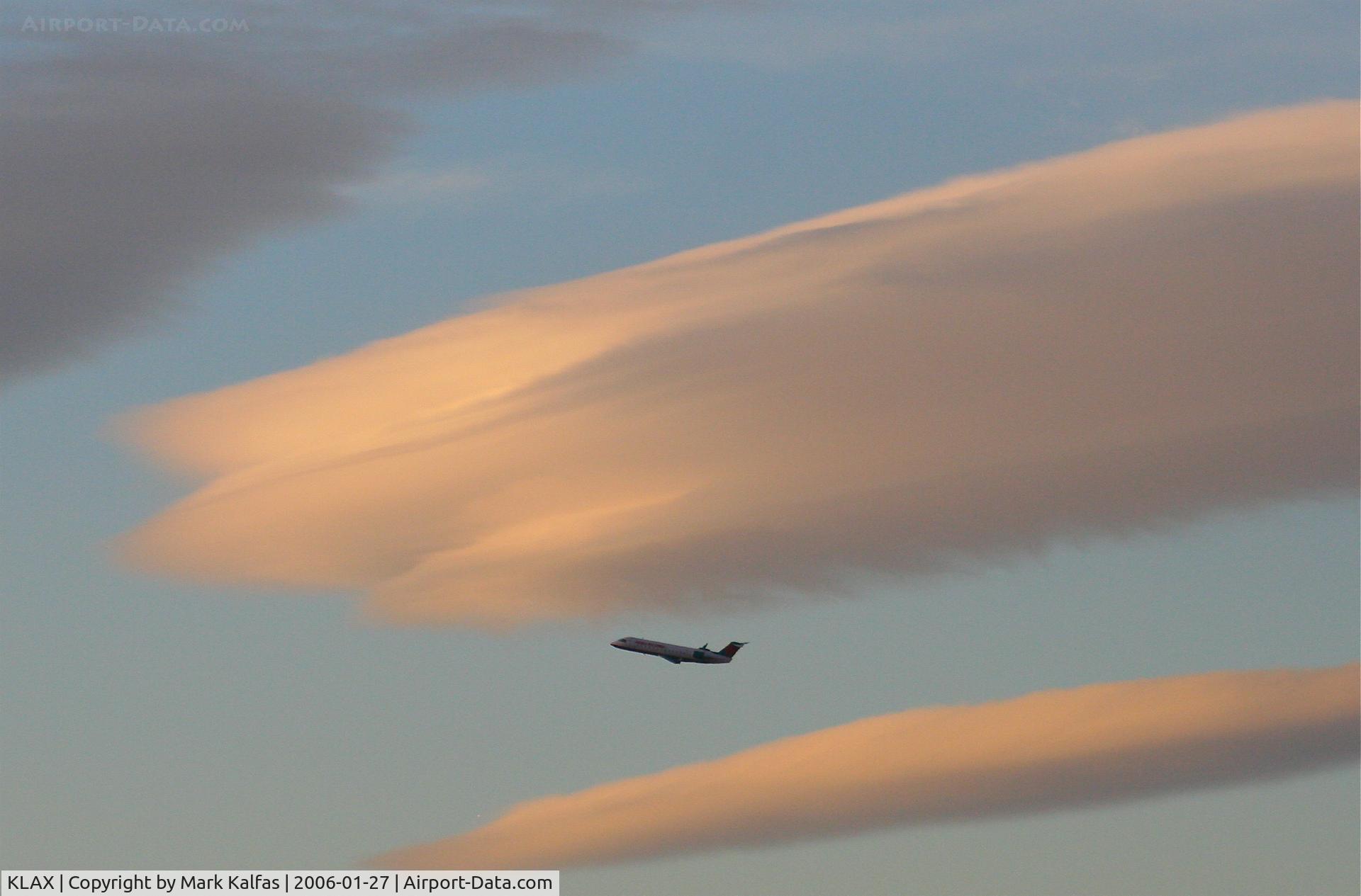 Los Angeles International Airport (LAX) - America West CRJ departing 24L KLAX with some lenticular clouds overhead.