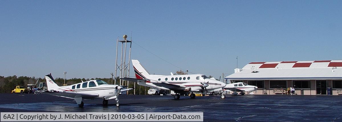 Griffin-spalding County Airport (6A2) - FBO at griffin with ramp being used by two Beechcraft and a Piper. 