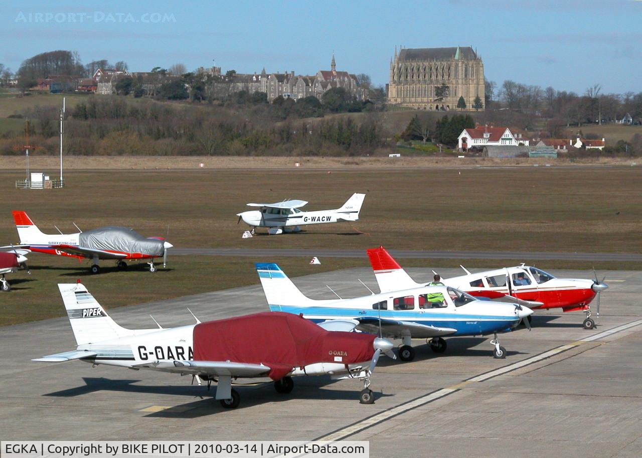 Shoreham Airport, Shoreham United Kingdom (EGKA) - PART OF MAIN APRON WITH LANCING COLLEGE IN BACK GROUND