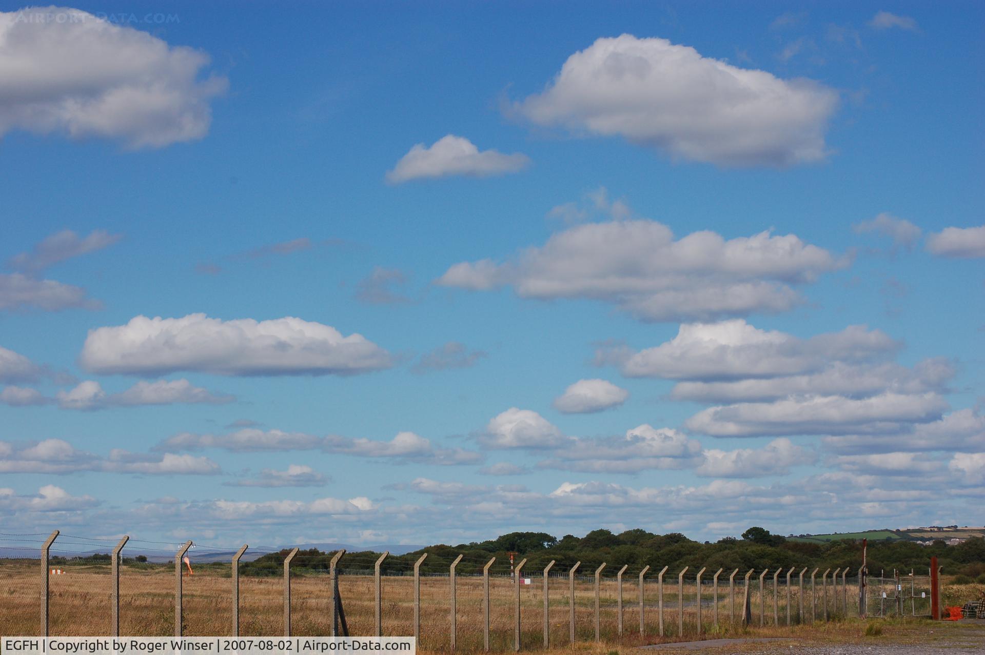 Swansea Airport, Swansea, Wales United Kingdom (EGFH) - Fair weather over the airport, a change from rain, haze and overcast