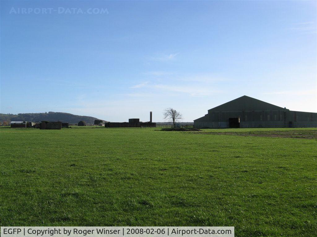Pembrey Airport, Pembrey, Wales United Kingdom (EGFP) - Former RAF Pembrey airfield technical site. Remaining buildings, one (of two) F type hangar and the land turned over to agricultural use