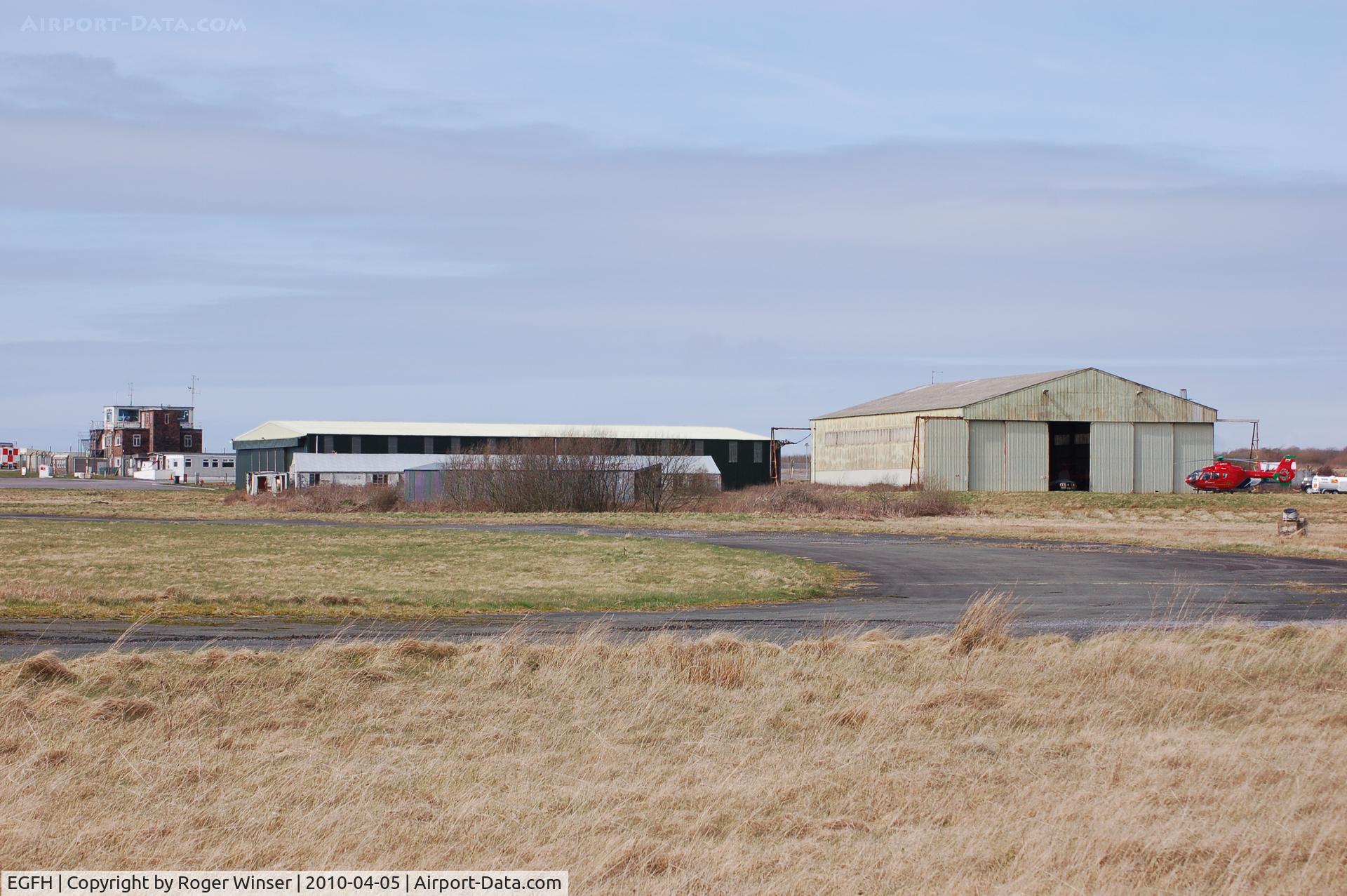 Swansea Airport, Swansea, Wales United Kingdom (EGFH) - View of the airport's Bellman (Hangar 2) and T2 hybrid? type 1 (Hangar 1) type hangars 