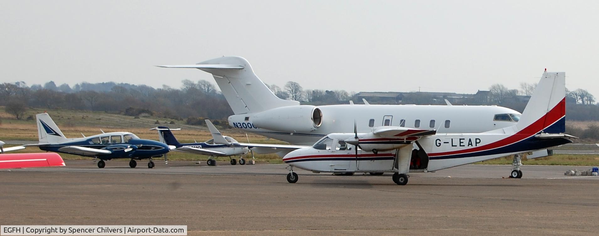 Swansea Airport, Swansea, Wales United Kingdom (EGFH) - N300GP BD100 Challenger 300. With G-LEAP taxiing in, can you still see the jumper in the back)