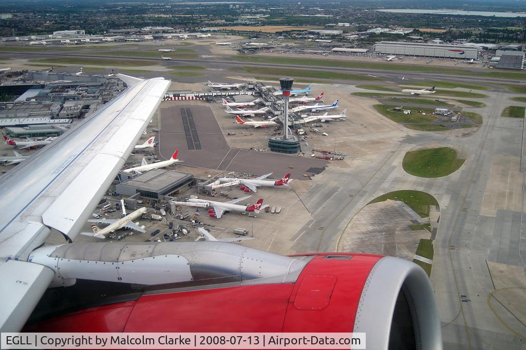 London Heathrow Airport, London, England United Kingdom (EGLL) - Passing Terminal 4 and the new control tower at London Heathrow as seen from Airbus G-DBCG in 2008. 