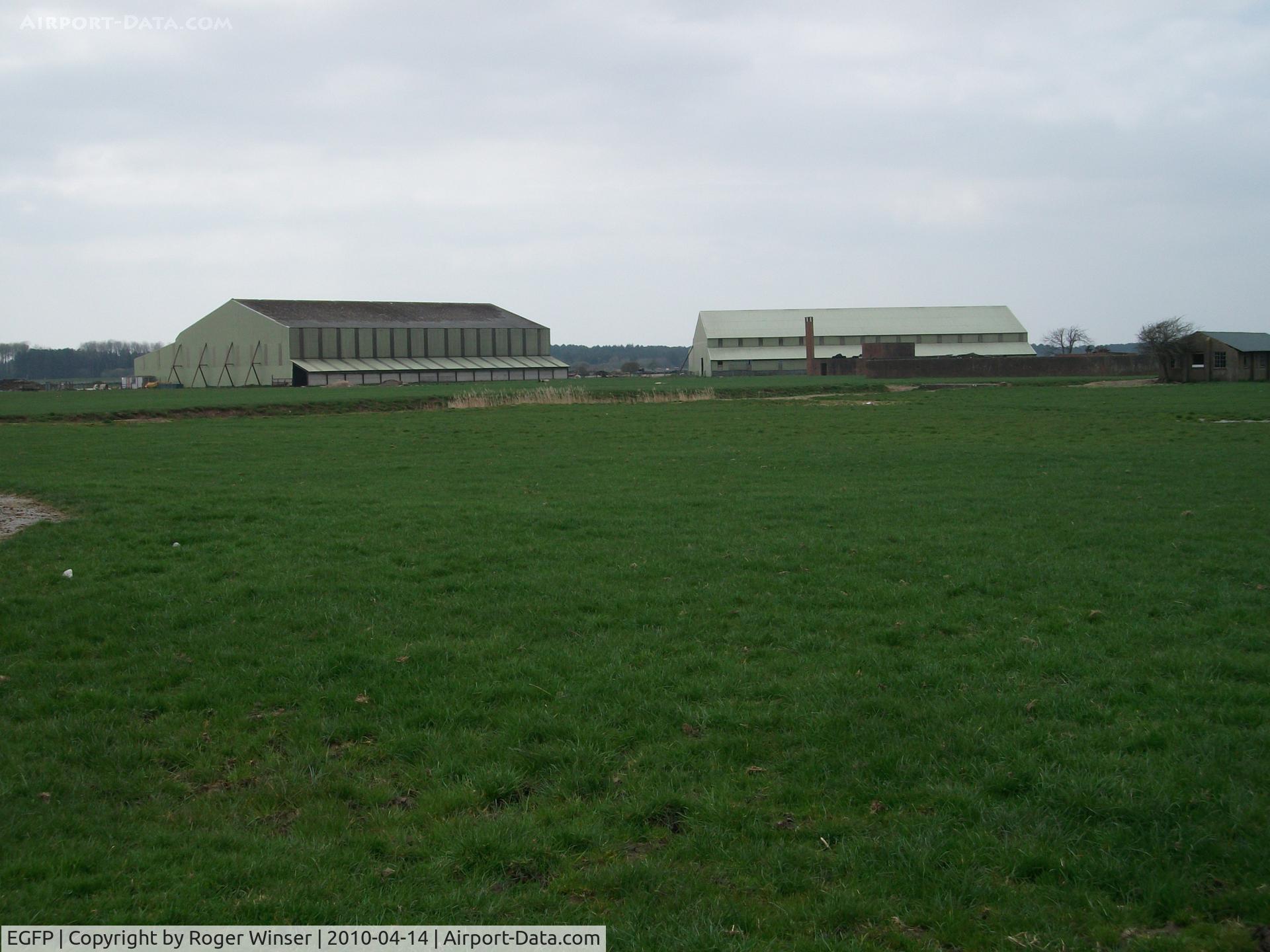 Pembrey Airport, Pembrey, Wales United Kingdom (EGFP) - The remaining two former F type sheds used for agricultural purposes. Located on the former RAF Station Pembrey airfield technical site.