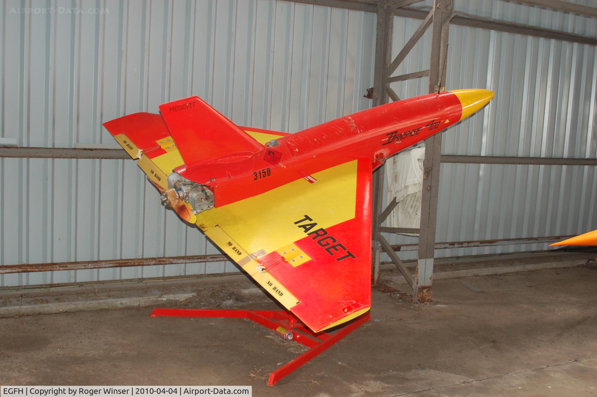 Swansea Airport, Swansea, Wales United Kingdom (EGFH) - Out of service Meggitt BTT-3 Banshee 400 target drone s/n 3150 stored at Swansea Airport in the care of 636 VGS. Moved to the Boscombe Down Aviation Collection at Old Sarum Airfield by April 2015.