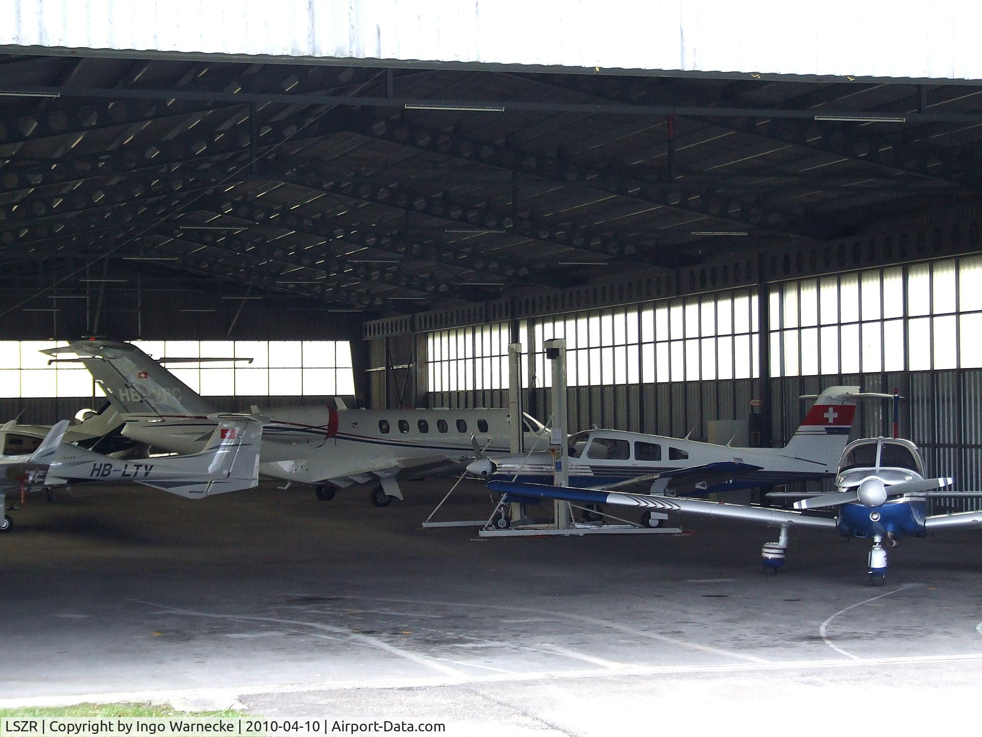 St. Gallen-Altenrhein Airport, Altenrhein Switzerland (LSZR) - Looking inside a hangar at St. Gallen-Altenrhein airfield, seen from the back side