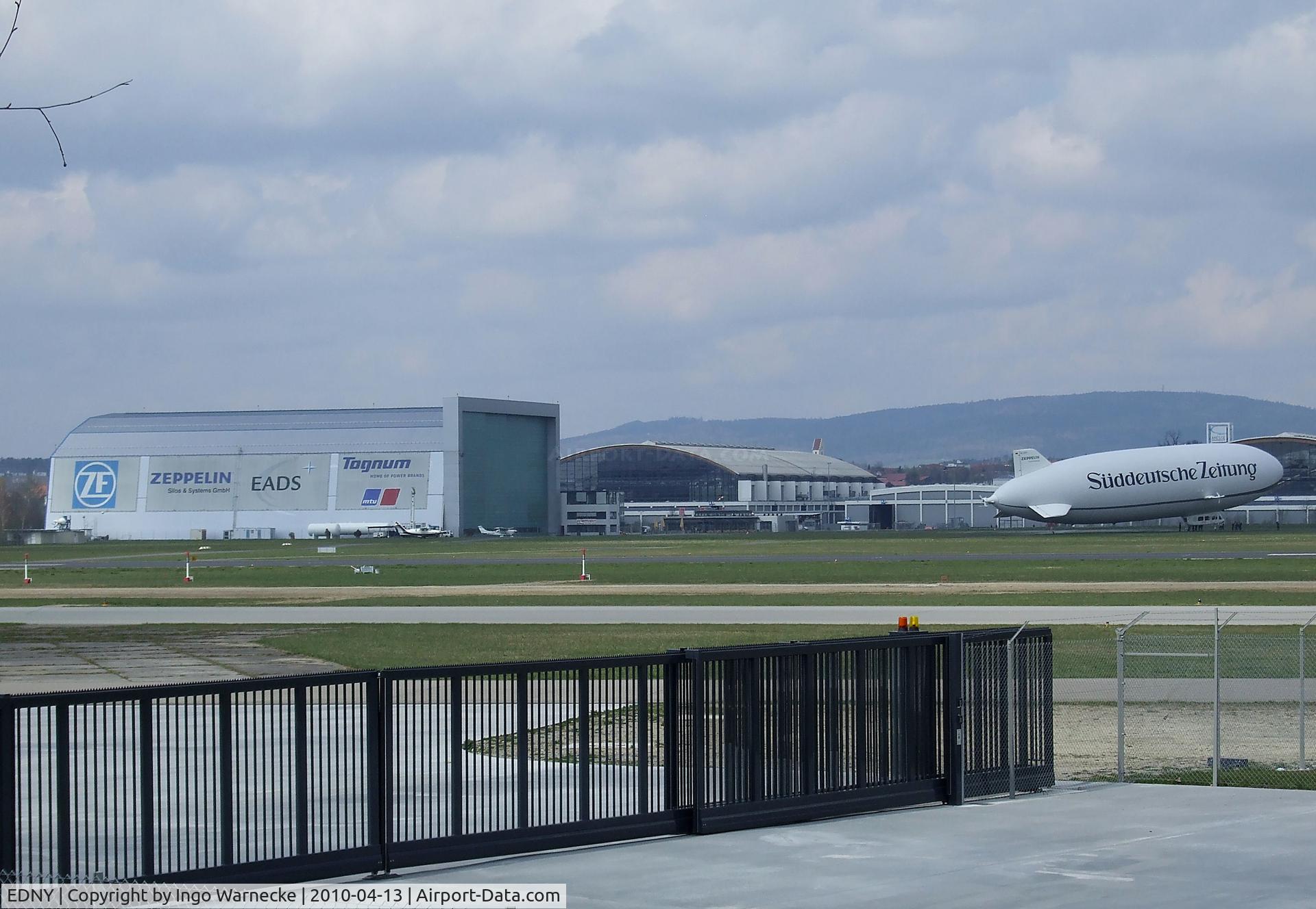 Bodensee Airport, Friedrichshafen Germany (EDNY) - Zeppelin-hangar and Zeppelin NT in front of the new commercial fairground