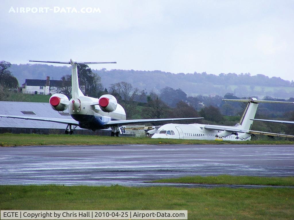 Exeter International Airport, Exeter, England United Kingdom (EGTE) - Embraer ERJ-145 and BAe 146 in storage at Exeter Airport