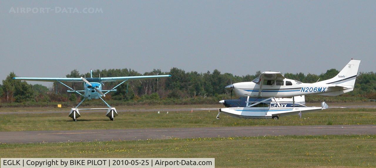 Blackbushe Airport, Camberley, England United Kingdom (EGLK) - VISITING CESSNA 206H N206MX AND RESIDENT CESSNA 182R G-ESSL 