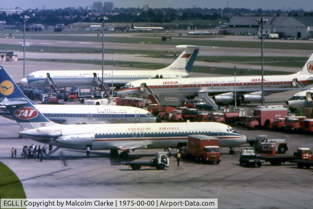 London Heathrow Airport, London, England United Kingdom (EGLL) - A view from the Queens Building at Heathrow Airport including a Yugoslav Airlines DC-9, a Lufthansa Boeing 737, an Iberian McDonnell Douglas DC8, an Aeroflot Ilyushin I-62M, and a BOAC Comet 4. 