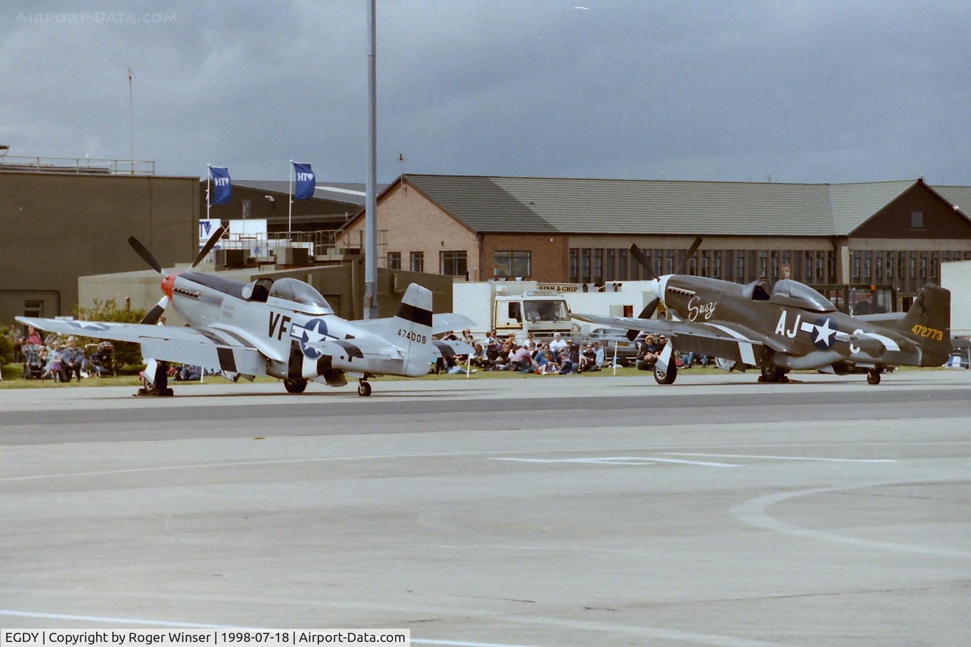 RNAS Yeovilton Airport, Yeovil, England United Kingdom (EGDY) - A pair of Mustangs on the apron at RNAS Yeovilton (HMS Heron) Air Day 1998.