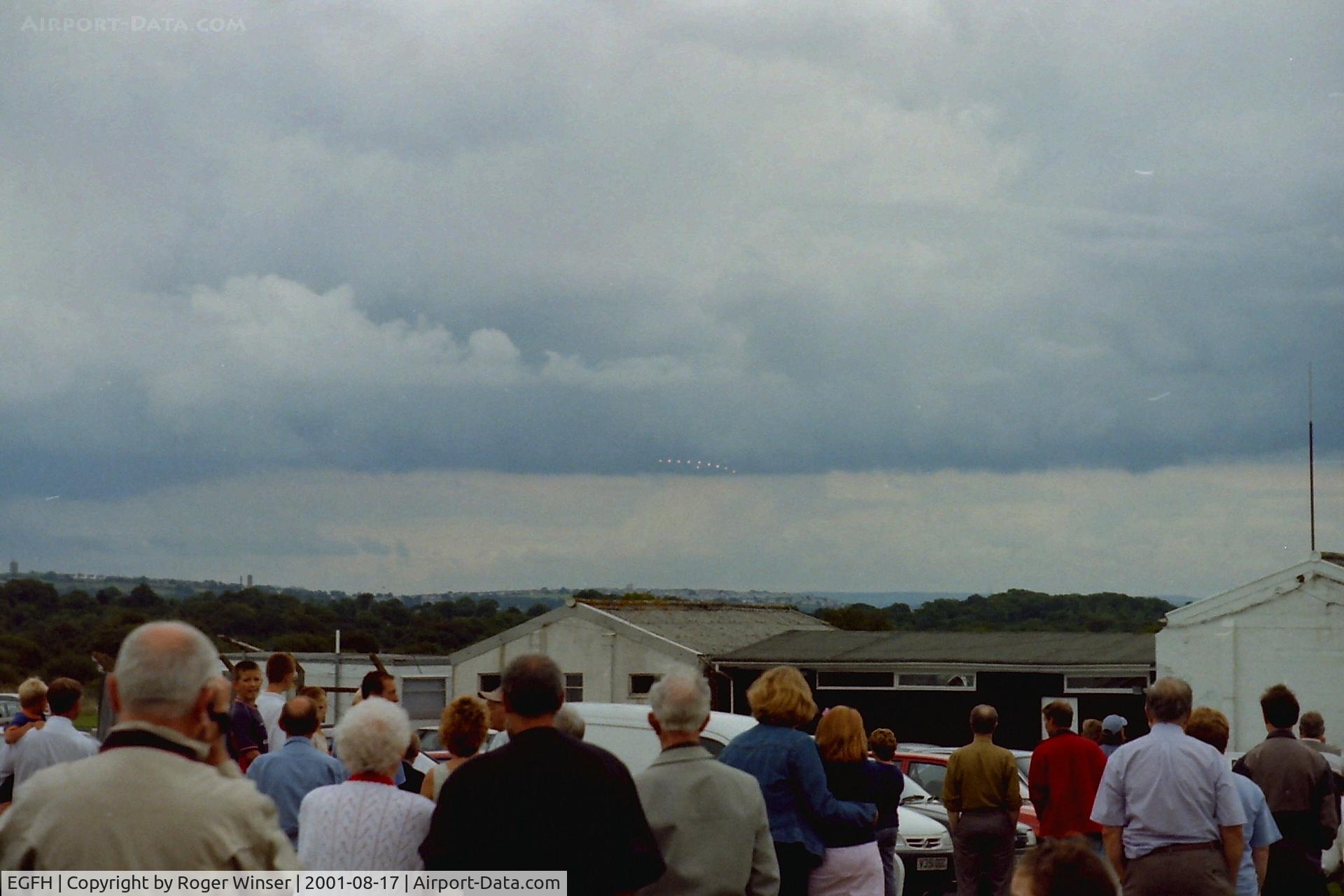 Swansea Airport, Swansea, Wales United Kingdom (EGFH) - The Red Arrows approaching the airport from the east on thier way from the Eastbourne Airshow to RAF Valley 