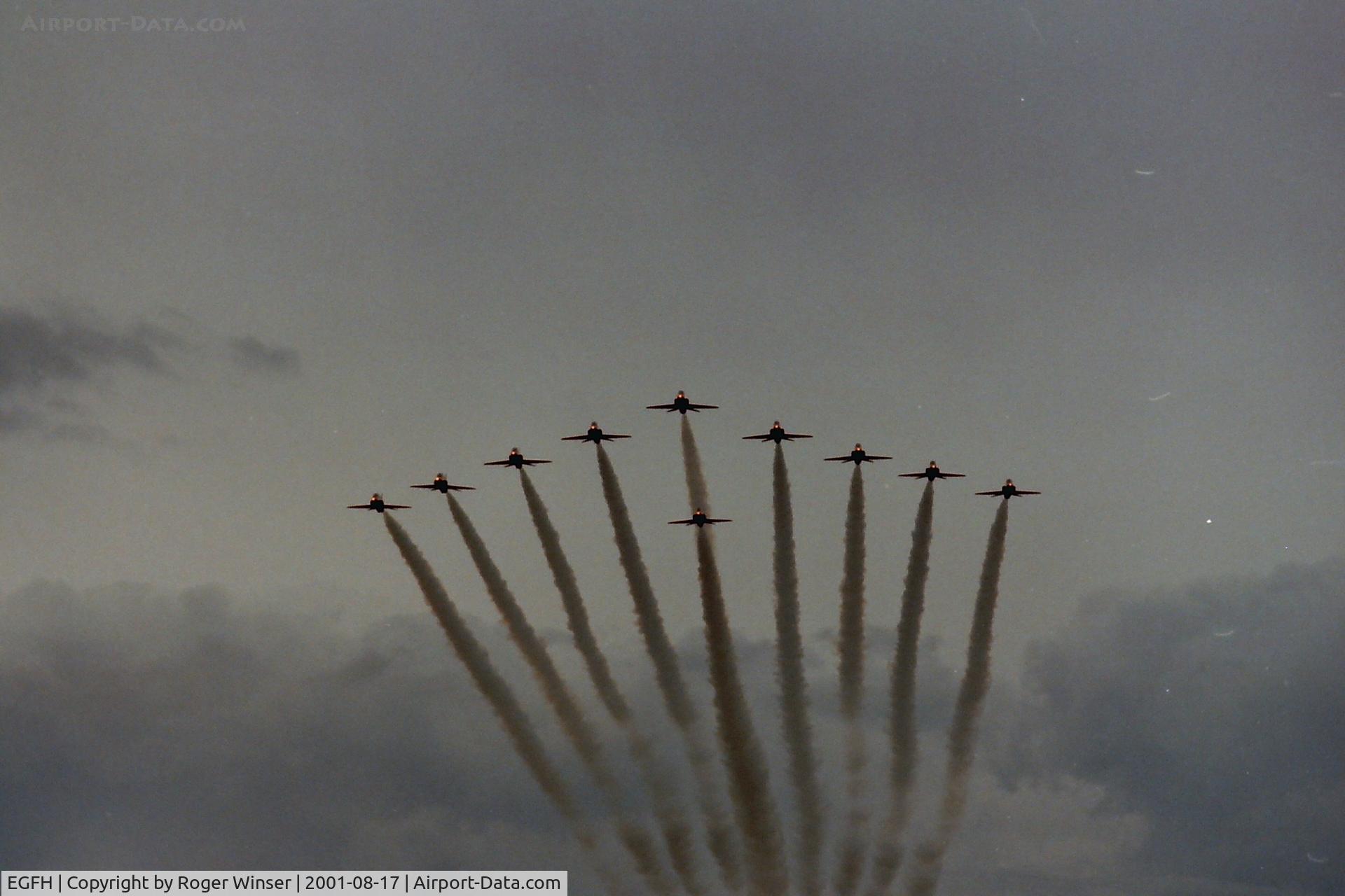 Swansea Airport, Swansea, Wales United Kingdom (EGFH) - The Red Arrows in 10 ship formation fly past over Swansea Airport on thier way to RAF Valley